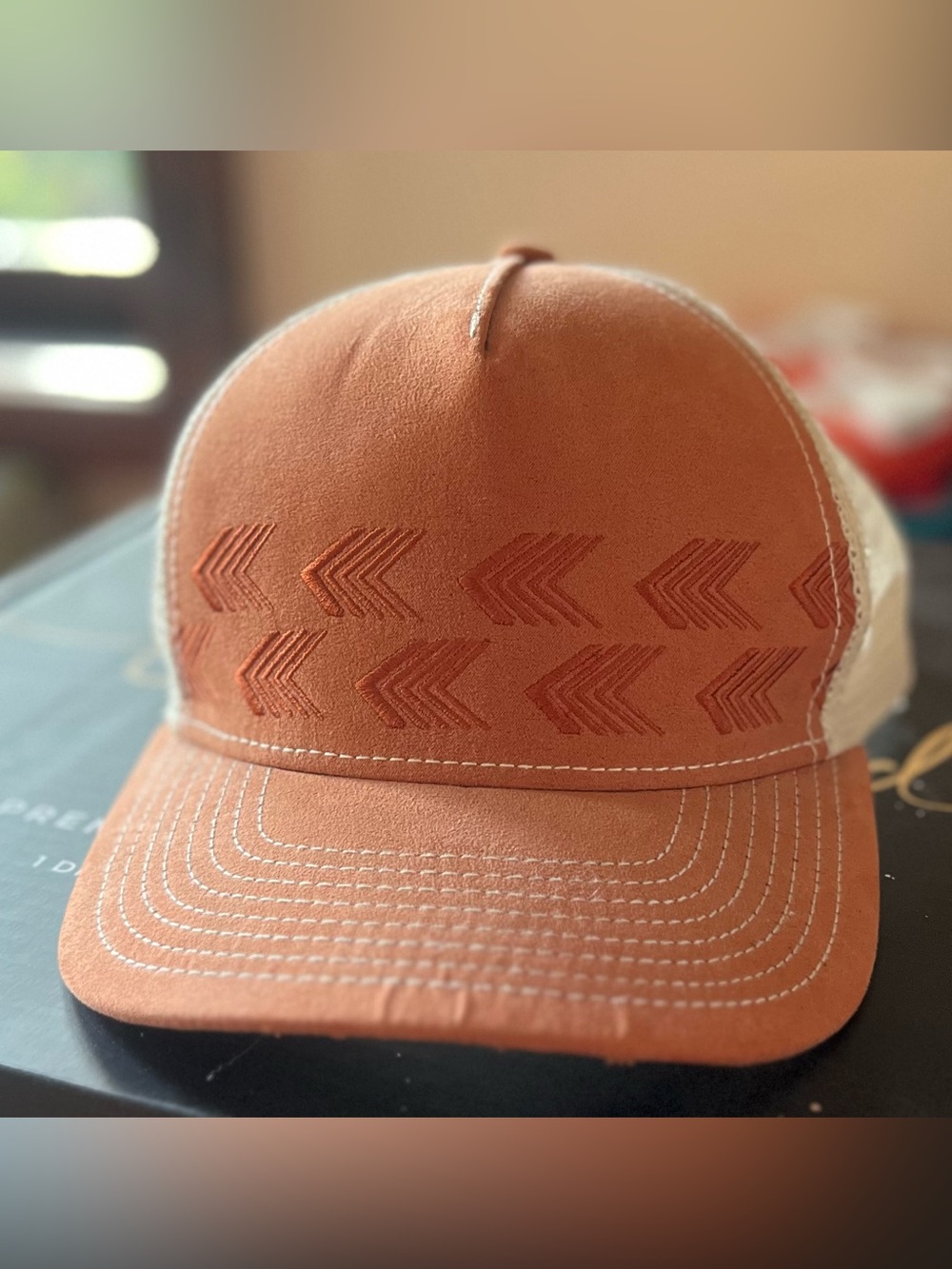pistil Rust Orange Arrow Embroidered Trucker Hat